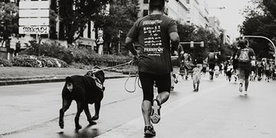 Runner with dog in Madrid, Spain ? Sergio Rodriguez Portugues del Olmo on Unsplash